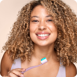 Woman Holding Toothbrush With Opal Whitening Toothpaste