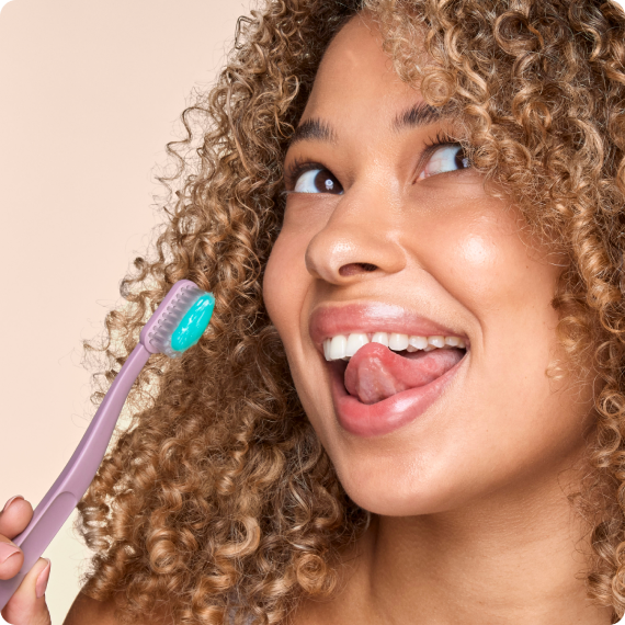 Woman Holding Toothbrush With Opal Whitening Toothpaste